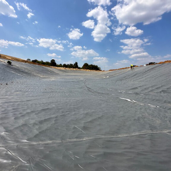 Installing geomembrane liner