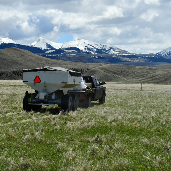 Native perennial fertilizer was applied with a truck and a pull-behind hopper-spreader cart