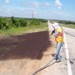 Using hydro mulch on roadside to establish vegetation quickly and prevent erosion.