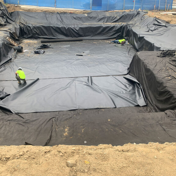 Instsalling R-Tank stormwater modules for ERTC terraced parking lot.