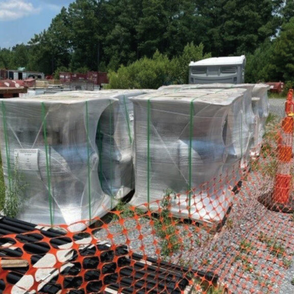 Staging large PVF delivery on job site.