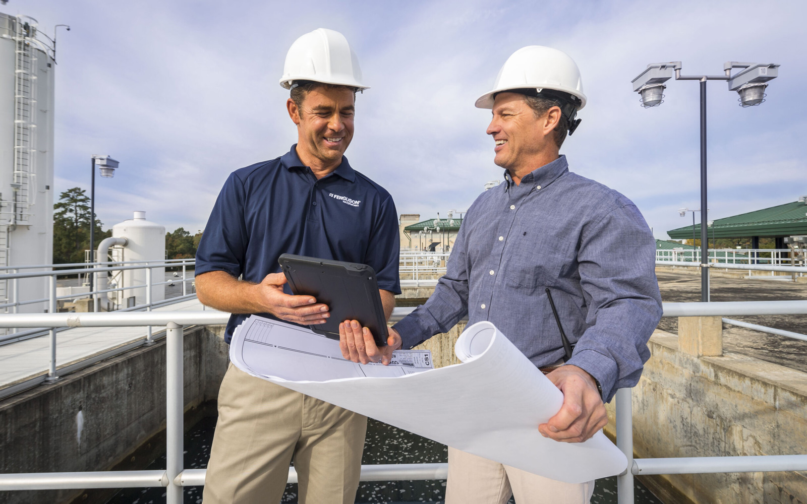 Ferguson Waterworks team on-site with blueprints.