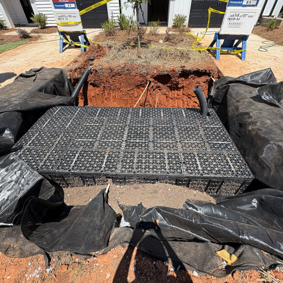 Installing soil cells between condo driveways