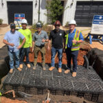 Construction crew standing on top of UrbanForest tree root cells.