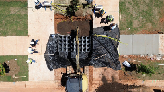 Overhead view of R-Tank UrbanForest Soil Cells between two urban sidewalks.