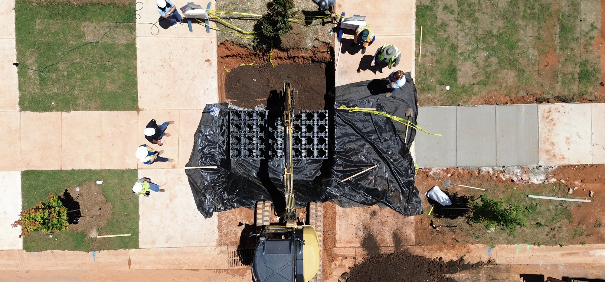 Overhead view of R-Tank UrbanForest Soil Cells between two urban sidewalks.