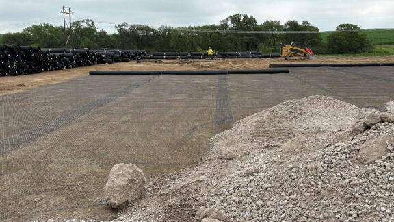 Gravel worksite with geogrid stabilization