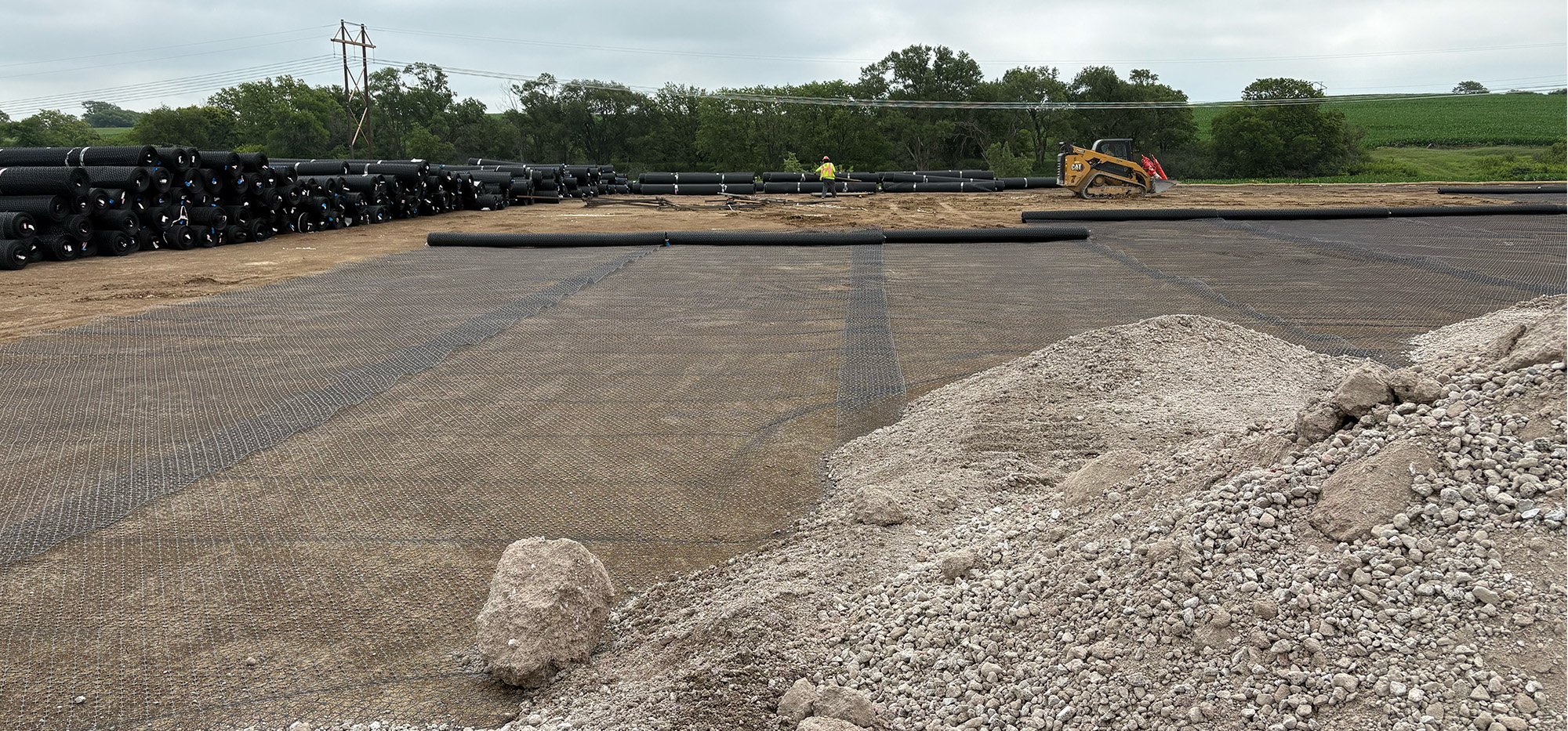 Gravel worksite with geogrid stabilization